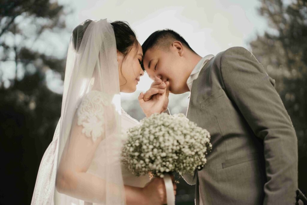 Find Local Wedding Photographers in Dubai - A couple picture in which groom kissing on bride's hand