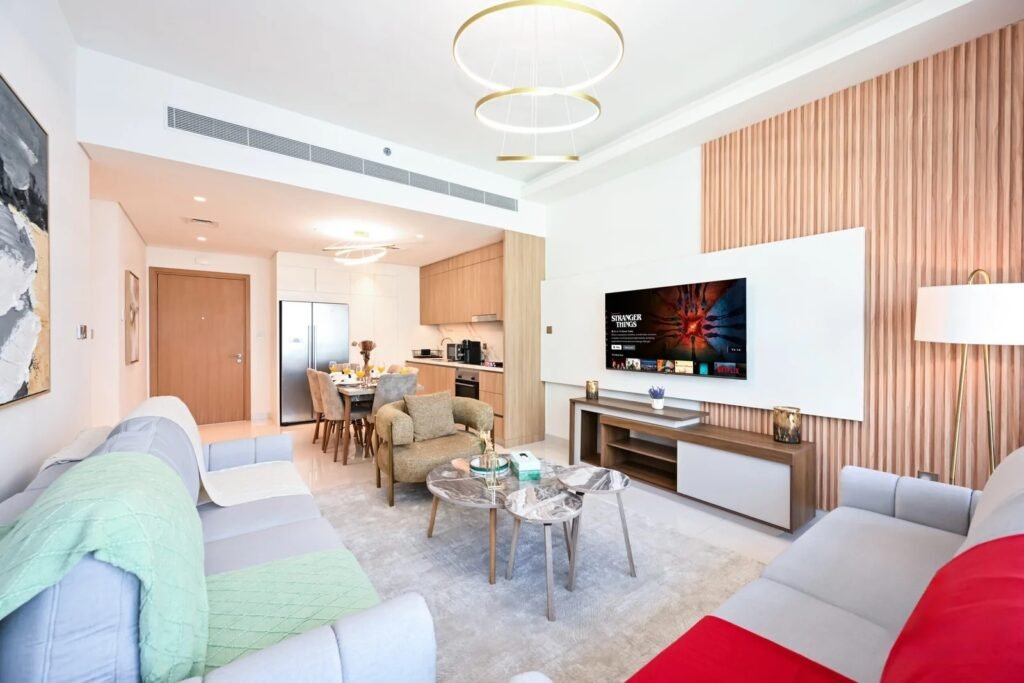 Real estate photography Dubai showcasing a bright modern apartment living room and kitchen
