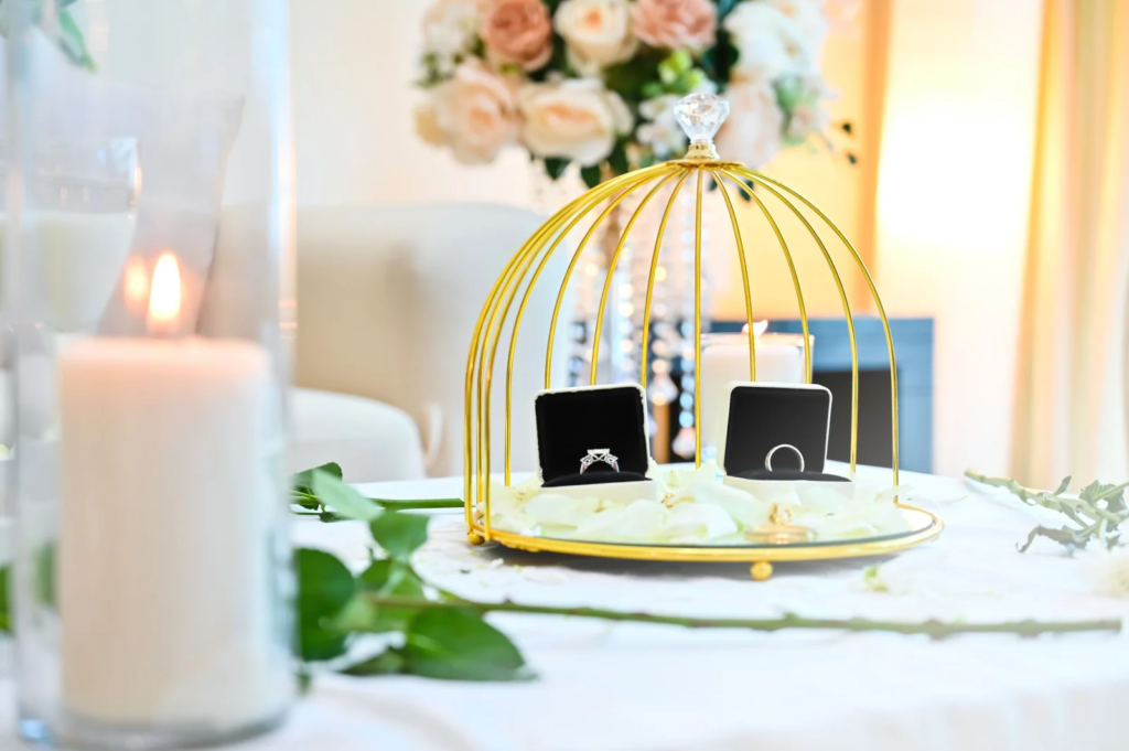 “Wedding rings displayed in elegant gold ring holder at a Dubai wedding”